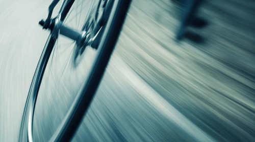 Blurred motion of bicycle wheel, speed and movement.